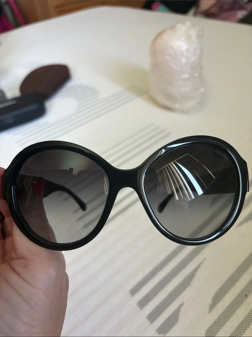 CHANEL Black Oversized Round Women's Sunglasses with iconic bows on each side.